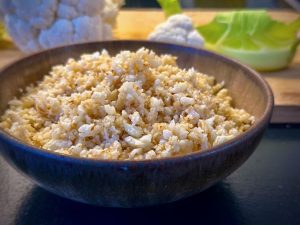 A brown bowl containing cauliflower rice
