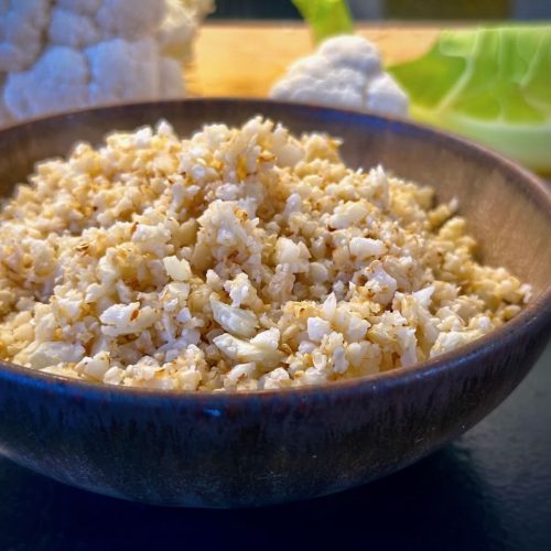 A brown bowl containing cauliflower rice