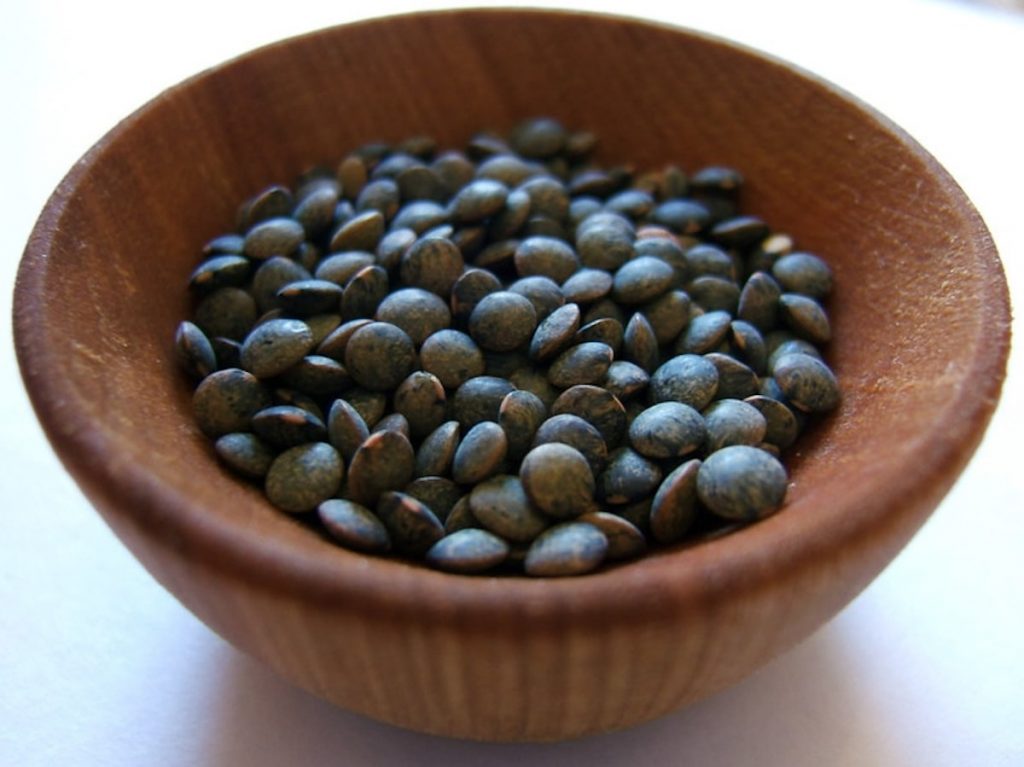 Green grey mottled colour of Puy lentils used in oven-roasted bell peppers